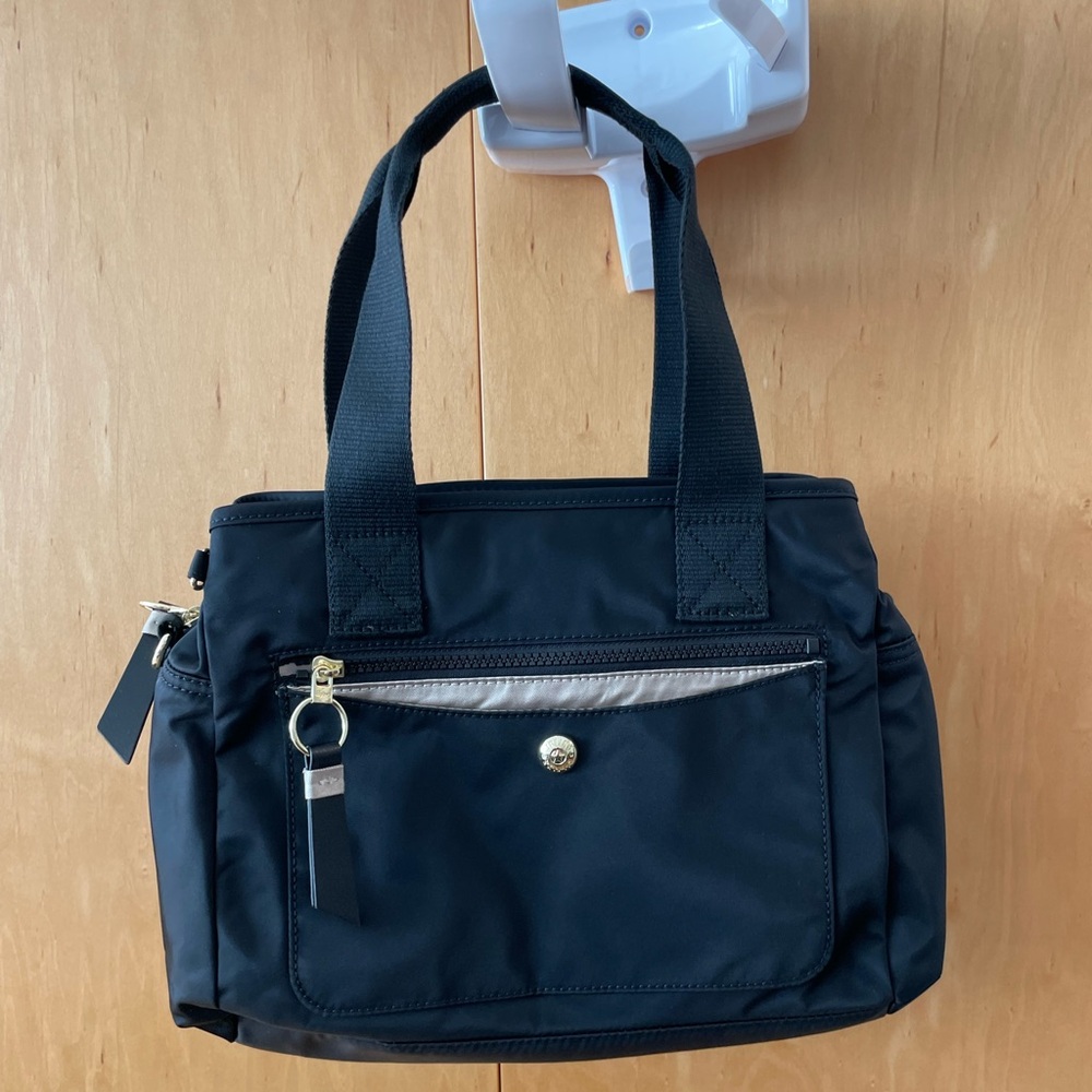 Kipling black nylon bag with top handles and detachable cross body strap. NEW!